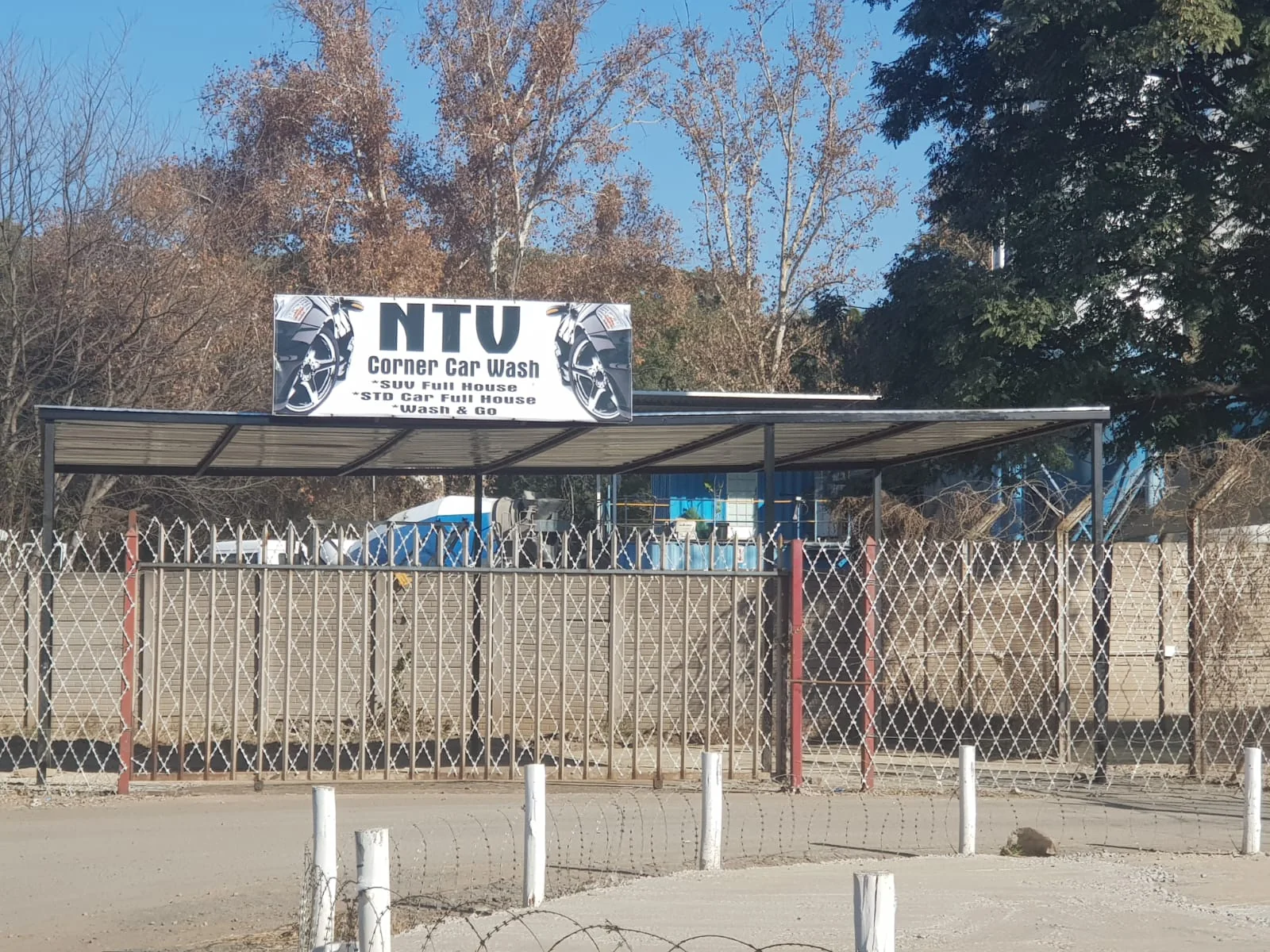 NTV Corner Car Wash entrance and sign