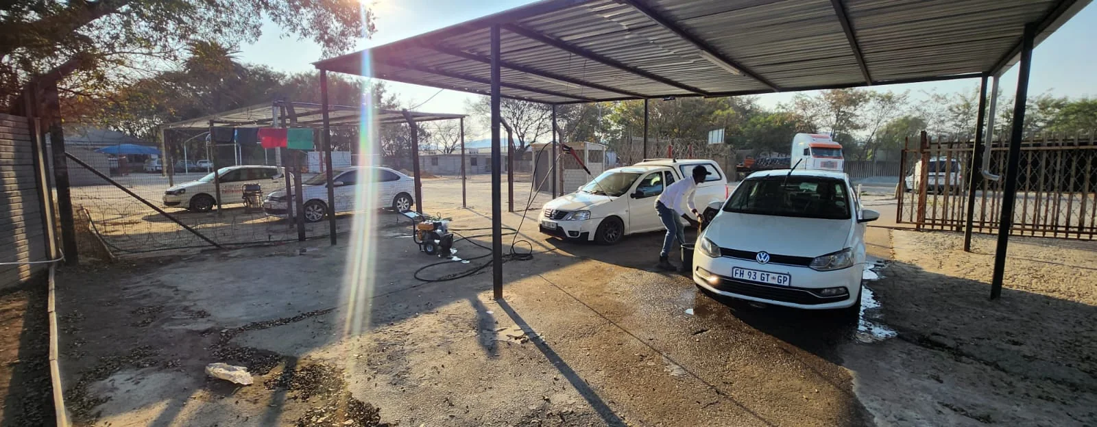 Vehicles being serviced under the NTV wash canopy